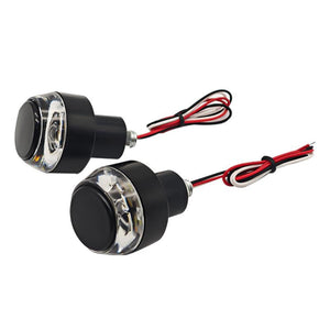 Par LED-blinkers med klart glas mot vit bakgrund